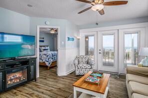 TV, fireplace - "Waters Edge 433-D" - Oceanfront Condo w/ Community Pool, 2 Bedrooms / 2 Bathrooms (Holden Beach)