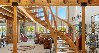 Riverfront views. Sleeps 12 with private dock.