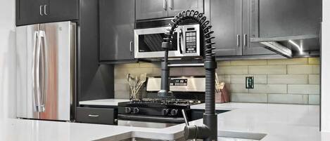 Coffee/tea maker, fridge, microwave, oven