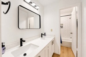Shower, hair dryer, towels, shampoo
