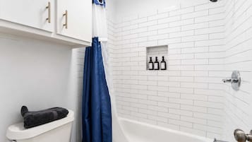 Shower, hair dryer, towels, shampoo