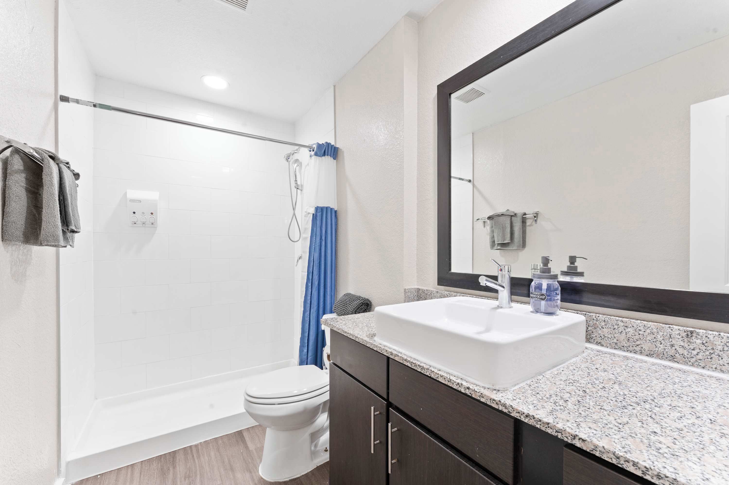 Shower, hair dryer, towels, shampoo