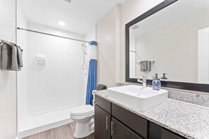 Shower, hair dryer, towels, shampoo