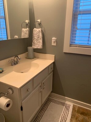 Bathtub, hair dryer, towels, soap