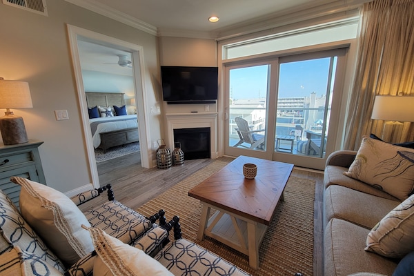 Living Area with pull-out sleeper sofa. Gas fireplace. Patio with bayviews.