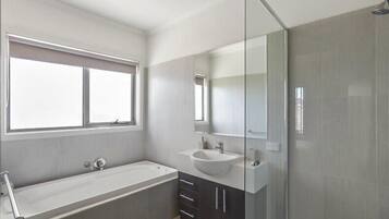 Bathtub, towels, shampoo