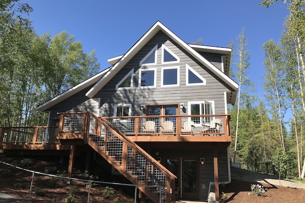 The back of the home with spectacular views from both inside and outside.
