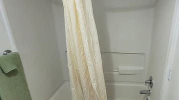 Combined shower/bathtub, designer toiletries, hair dryer, bathrobes