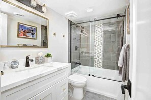 Combined shower/tub, hair dryer, towels, soap