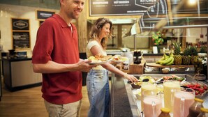 A buffet area with a variety of food and drink options, including fruits, sandwiches, and smoothies. - Hotel De Eemhof by Center Parcs (Zeewolde)