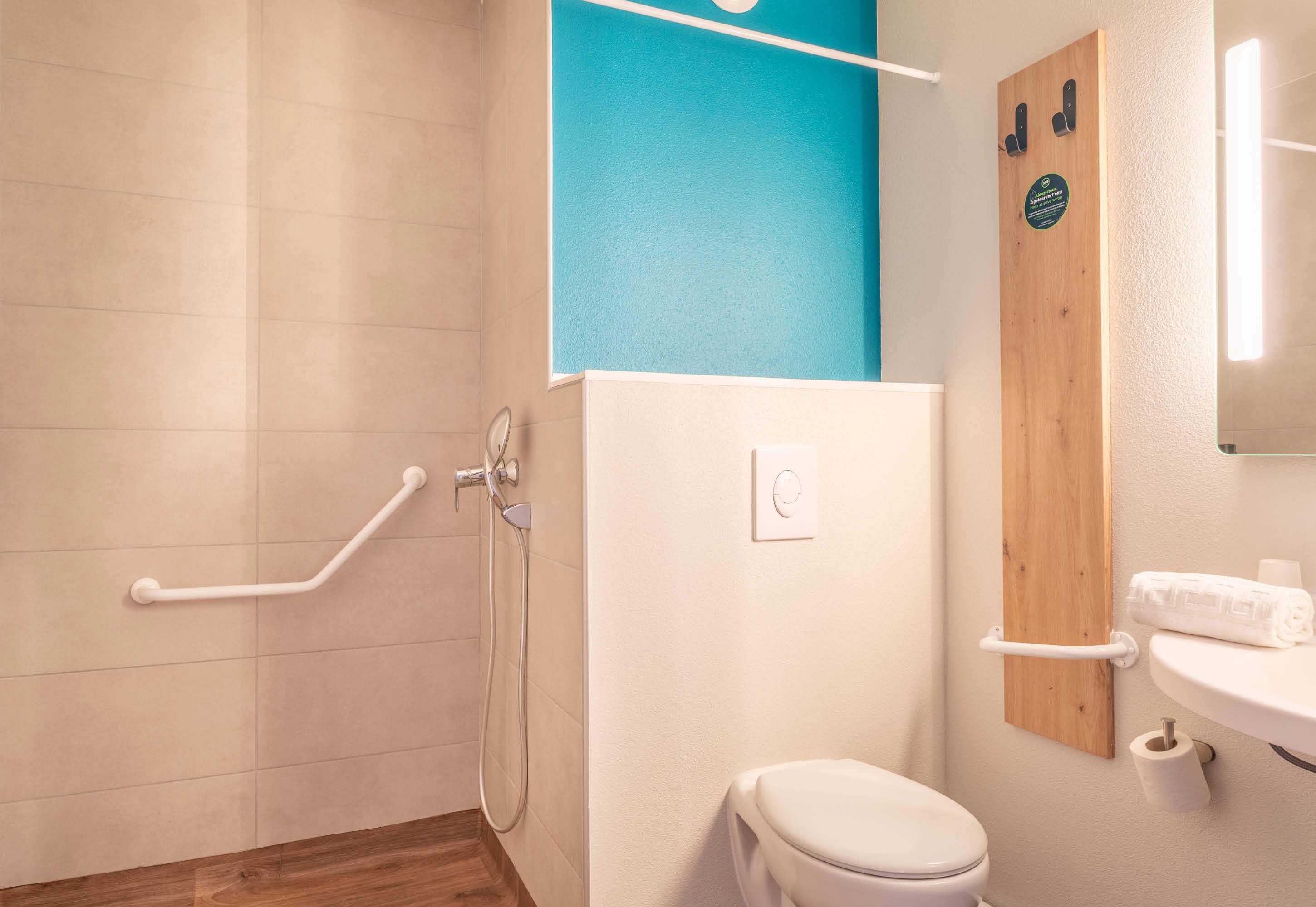 double room, mobility accessible | bathroom | shower, towels, soap, shampoo