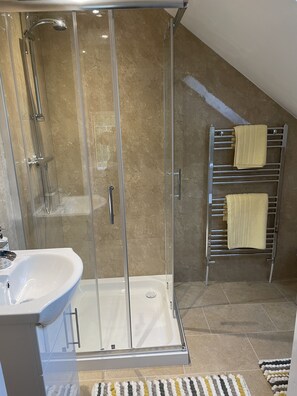 Shower, hair dryer, towels, soap