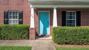 A two-story brick house with a blue front door, white shutters, and a number '29' on the wall. - Superb For Traveling Workers Near Cartersville (Cartersville)