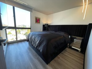 2 habitaciones, tabla de planchar con plancha y cuna de viaje 