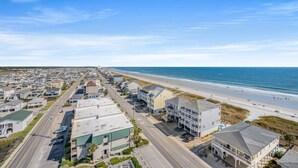 A coastal town with a beachfront, rows of houses, and a road leading to the beach. - Beachwalk Villas 808-2BR/2BA Condo in Cherry Grove (North Myrtle Beach)