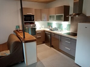 Dishwasher, dining tables, kitchen islands