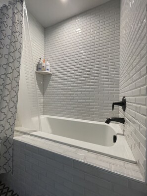Combined shower/tub, hair dryer, towels, soap