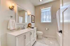 Combined shower/tub, hair dryer, towels, soap