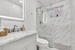Shower, hair dryer, towels, soap