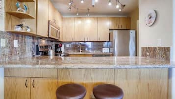 Microwave, dishwasher, coffee/tea maker, cookware/dishes/utensils