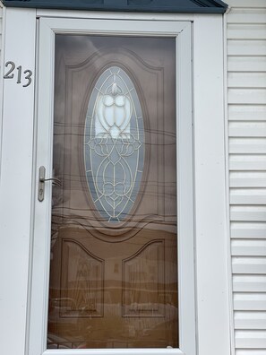 Enter through door 213, featuring a glass panel and solid panel below.