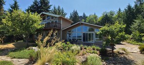Exterior - Modern retreat with serene canal, forest, and mountain views. (Lilliwaup)