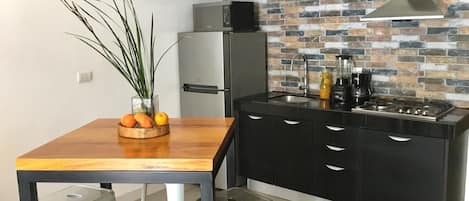 Fridge, microwave, stovetop, coffee/tea maker