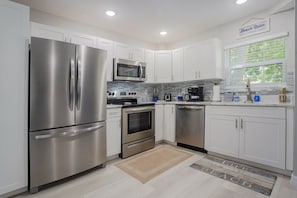 Microwave, dishwasher, coffee/tea maker, cookware/dishes/utensils