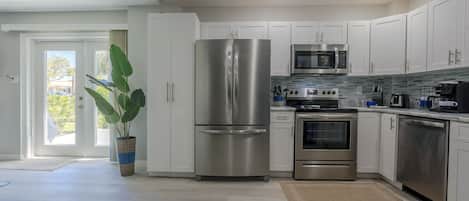 Microwave, dishwasher, coffee/tea maker, cookware/dishes/utensils