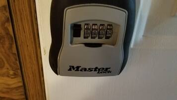 A Master Lock combination lock attached to a door.