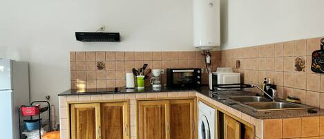 Fridge, microwave, stovetop, coffee/tea maker