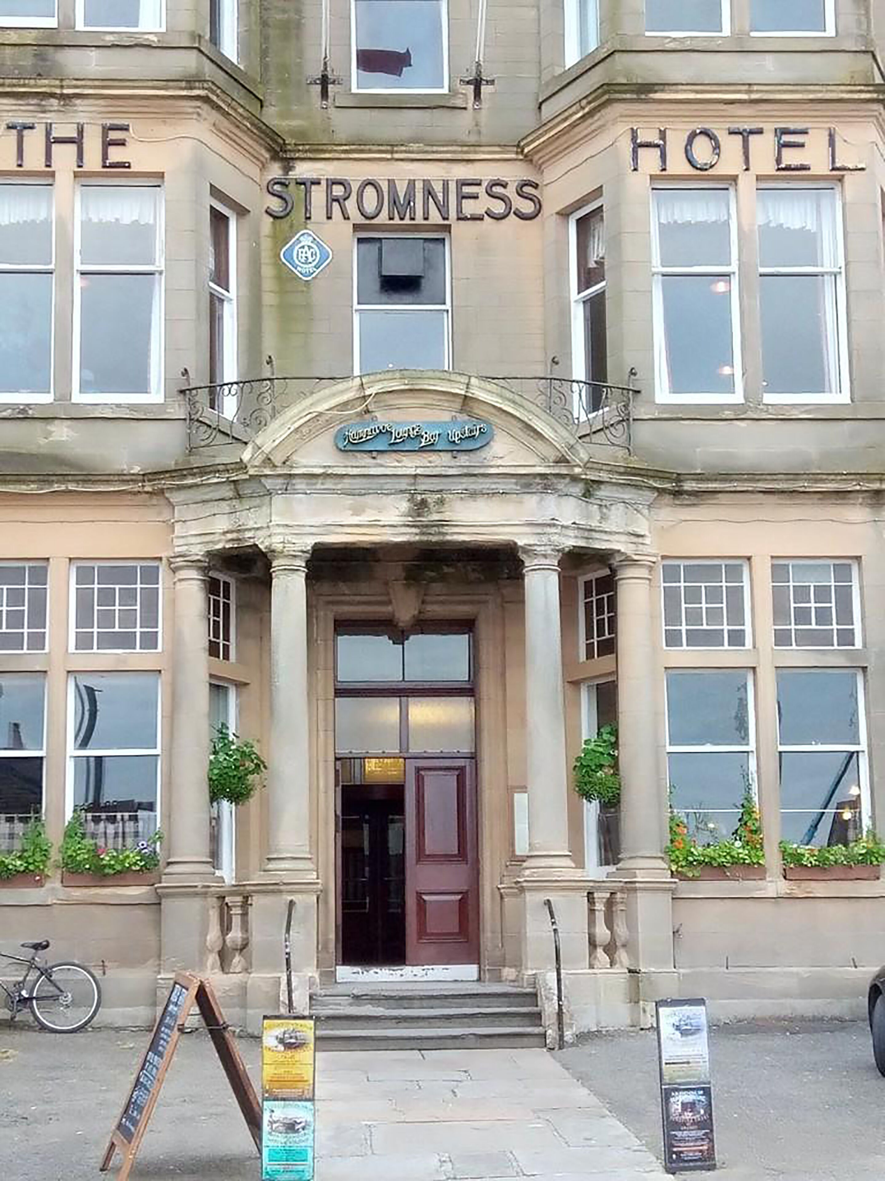 A building with a sign reading "The Stromness Hotel" above the entrance.