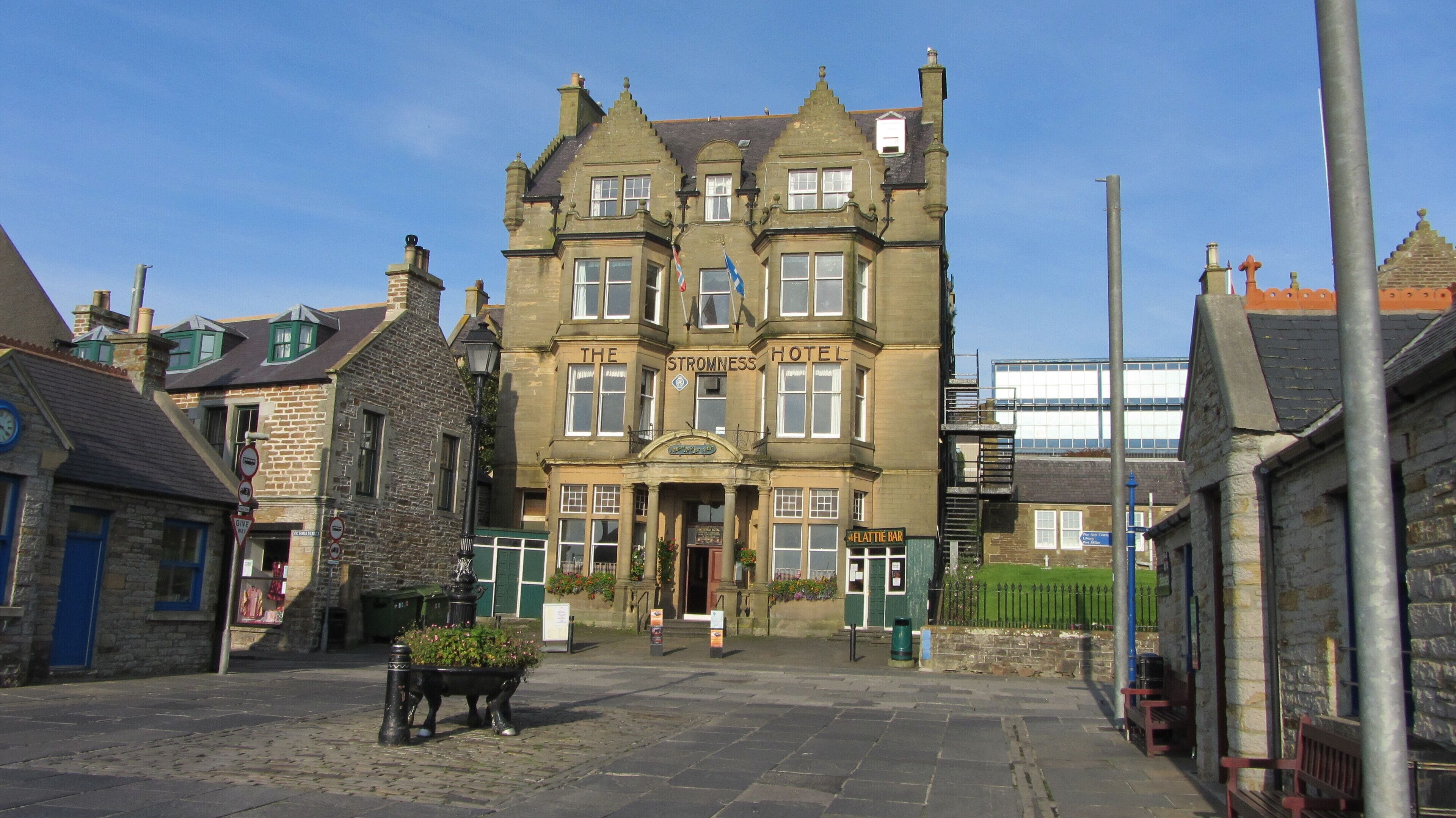 A historic building with a sign reading "The Stromness Hotel."