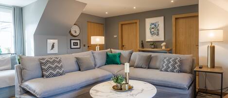 Deluxe 2 Bed Apartment | Living area | 75-inch TV with digital channels