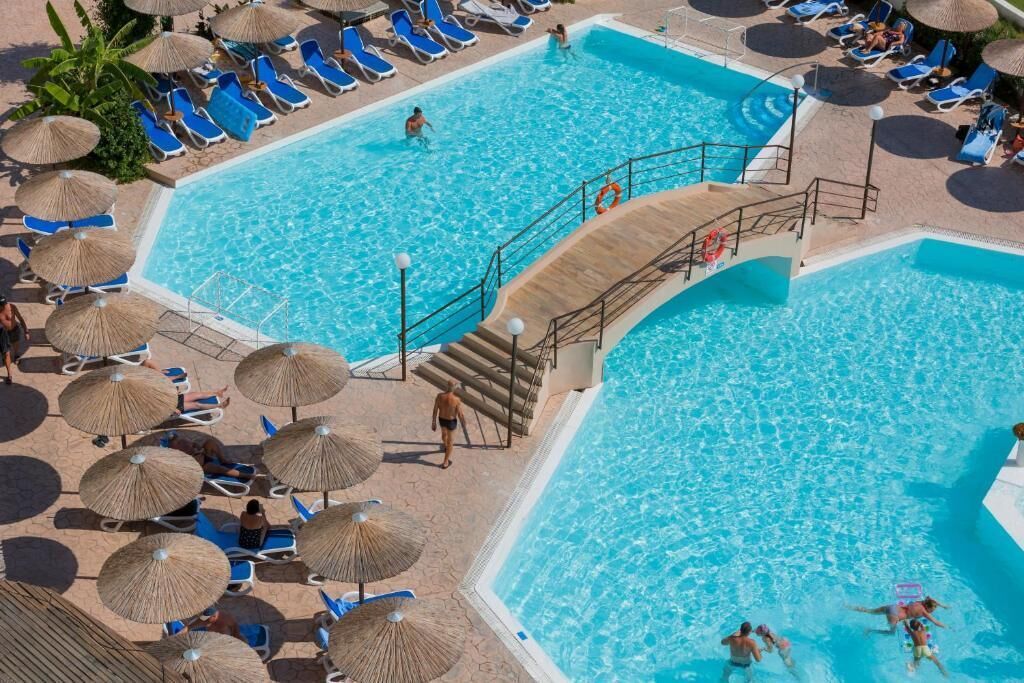 Seasonal outdoor pool, open 10:00 AM to 6:00 PM, pool umbrellas