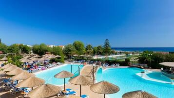 Seasonal outdoor pool, open 10:00 AM to 6:00 PM, pool umbrellas