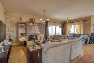 Family House, Multiple Bedrooms, Mountainside (The House Olympia) | Living area | 21-inch flat-screen TV with cable channels, TV, fireplace