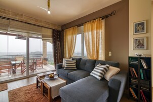 Family House, Multiple Bedrooms, Mountainside (The House Olympia) | Living area | 21-inch flat-screen TV with cable channels, TV, fireplace