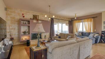 Family House, Multiple Bedrooms, Mountainside (The House Olympia) | Living area | 21-inch flat-screen TV with cable channels, TV, fireplace