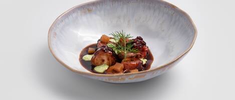 A bowl of food with a rustic design.