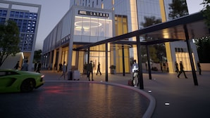 A modern hotel with a prominent entrance, a glass facade, and a sign reading "HOTEL LATOUR." - Hotel La Tour (Milton Keynes)