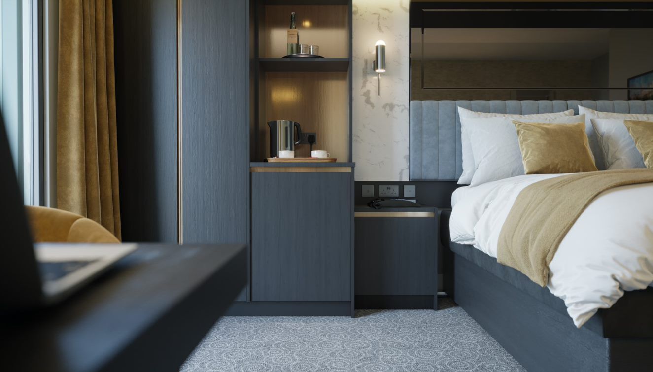 A modern hotel room with a bed, bedside tables, a built-in shelf, and a wall-mounted light fixture.
