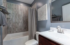 Combined shower/tub, hair dryer, towels, soap