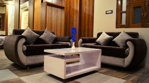 Quarto executivo | Área de estar | TV de tela plana