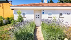 A villa with a white exterior, red-tiled roof, and a number '17' on the door. - Villa Ziziphus - Private Pool with Jacuzzi (Premantura)