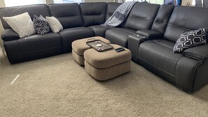 A sectional sofa with a matching ottoman, a small side table, and decorative pillows. - Beautiful Grayhawk Condo!  Negotiated rates and FLEXIBLE Dates-contact owner (Scottsdale)