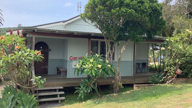 A two-story building with a porch, a sign reading 'Good Vibes,' and a tree in front. - Good Vibes, 18 East Street (Crescent Head)