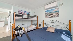 A bunk bed room with a single bed, a desk, and a chair. - Heathers Seaside Apartments 2, 10 Rankine Street (Crescent Head)