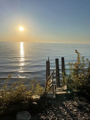 Enjoy a serene coastal escape with a tranquil ocean view and picturesque pier.