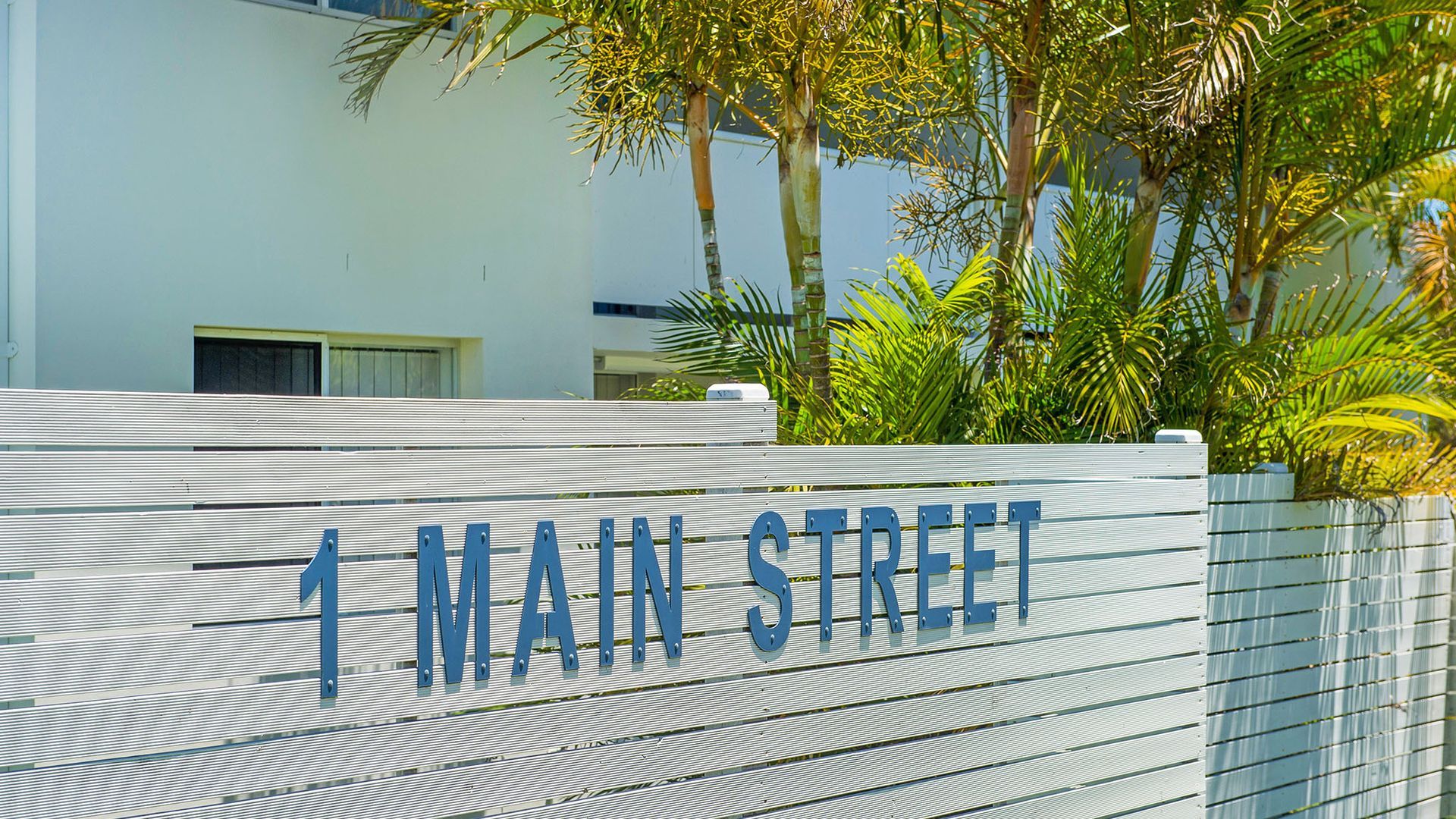 A sign with '1 MAIN STREET' indicating the name of the street.